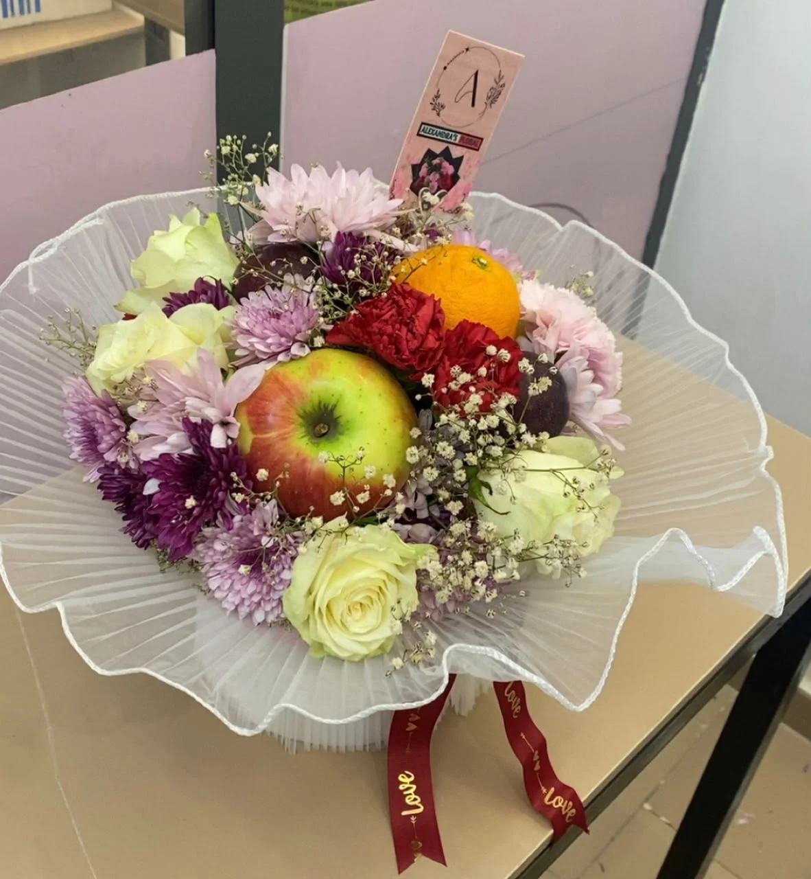 Floral and fruit arrangement by Alexandra's Floral