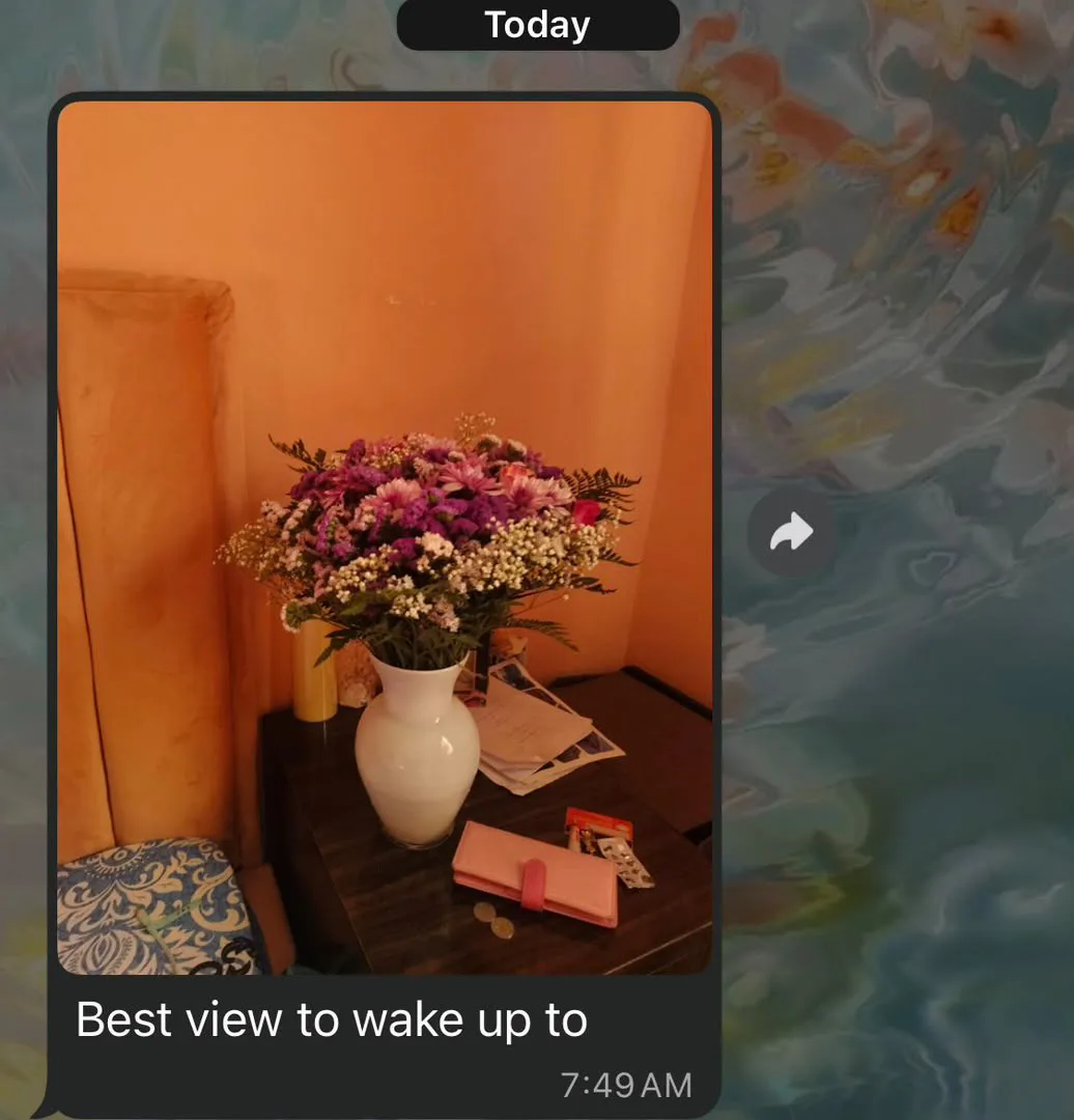 Customer WhatsApp message showing flowers and a happy reaction